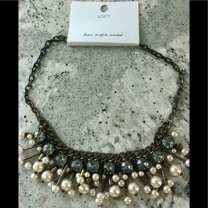Pearl and grey stone necklace.
